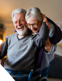 Elderly couple hugging